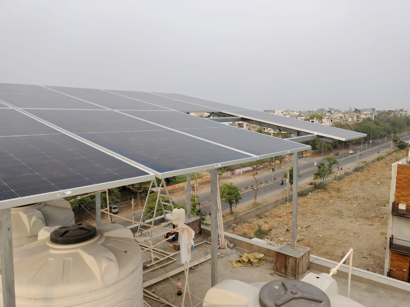 Leak-proof TATA GI and Apollo GP rooftop solar structure with maintenance walkway in Kerala